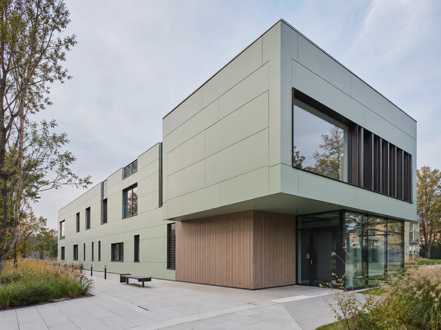 Contemporary Scandinavian building clad in pastel aluminium composite panels.