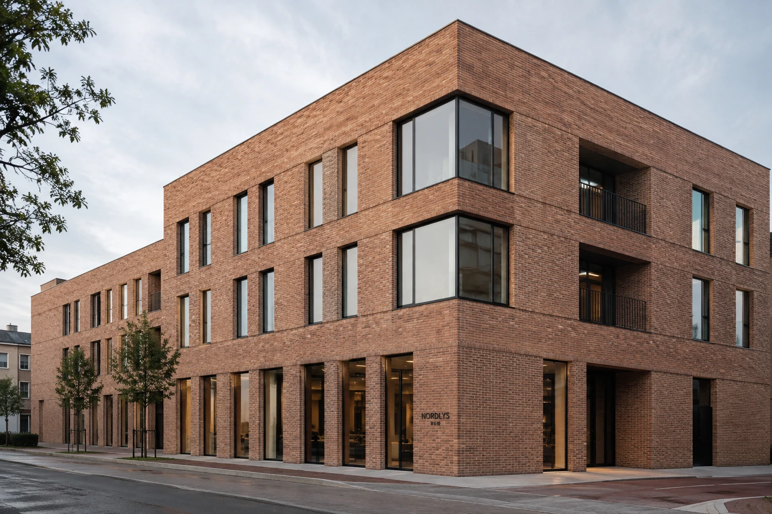Contemporary Nordic brick-clad building using a panelised façade system.