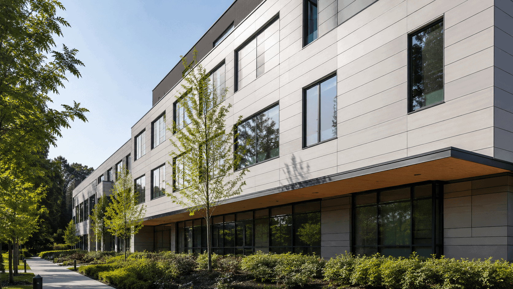 Modern building exterior clad with eco-friendly fiber cement boards in a sustainable architectural setting