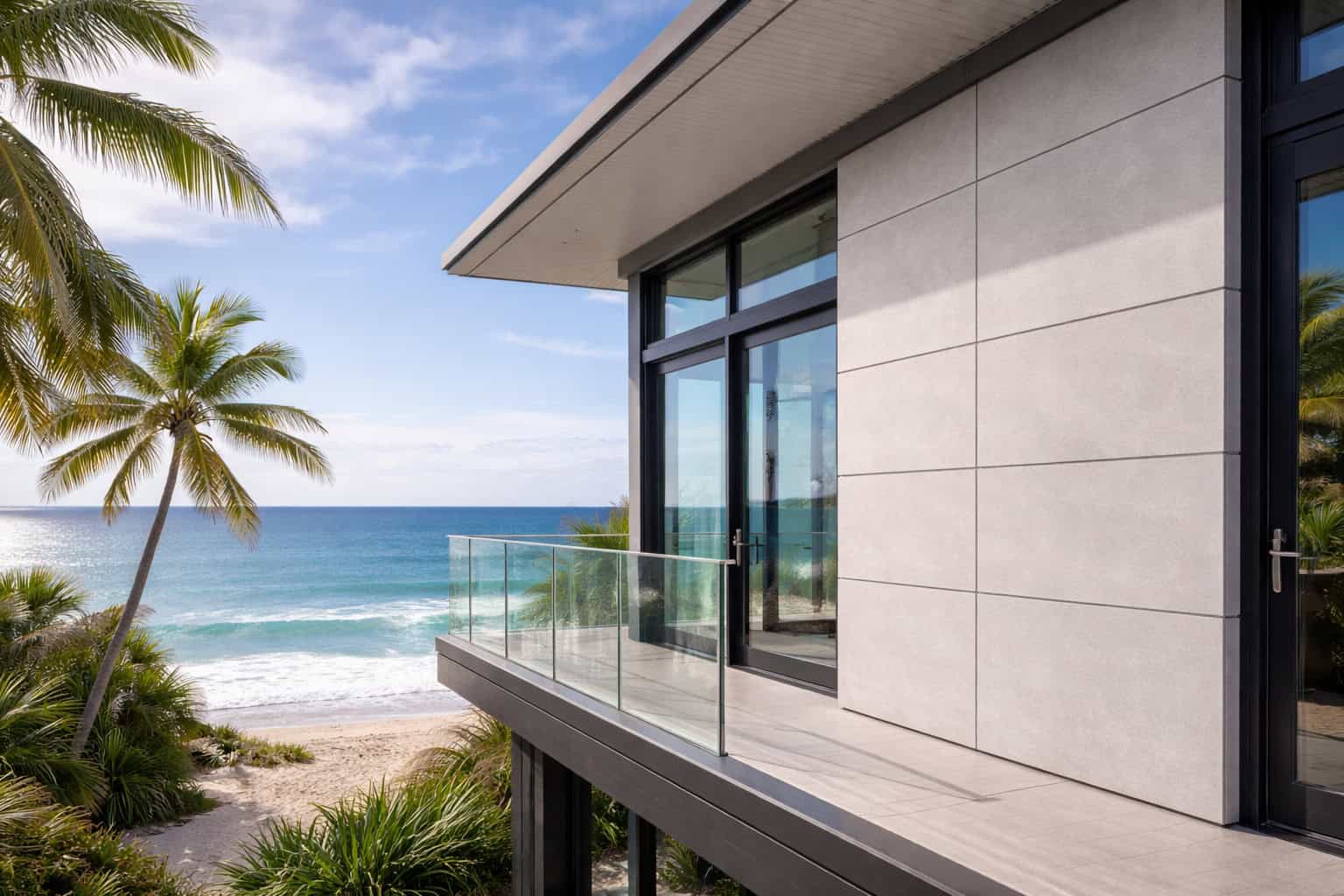 Modern coastal building with fiber cement board façade demonstrating humidity resistance in a seaside environment